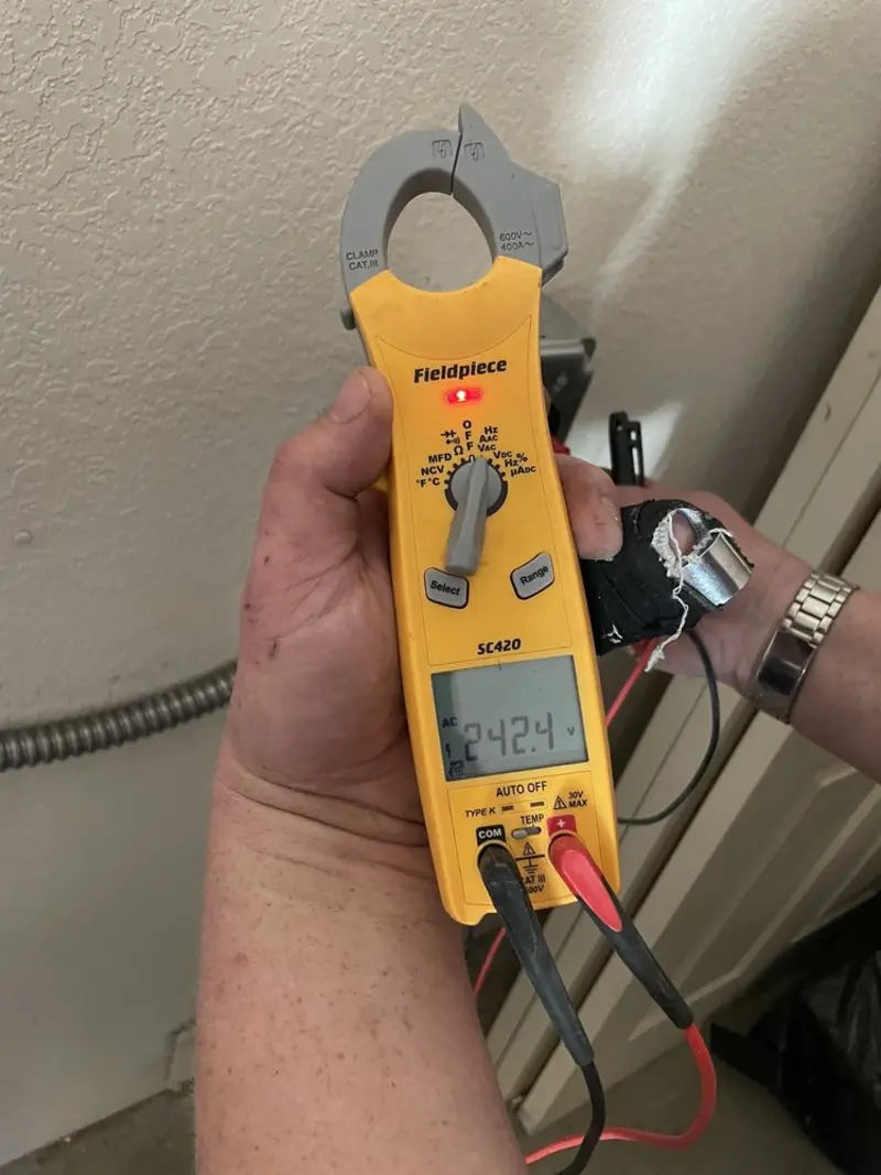 Voltage testing with clamp meter during Outlet Installation in Pittsburgh